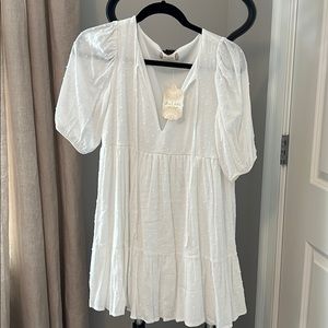 New w tag.  Dress in white, fully lined.  Small